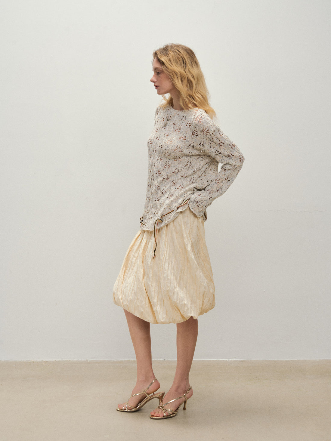 Dpercent 25SS A half-length skirt with slanted-cut and distorted texture structure
