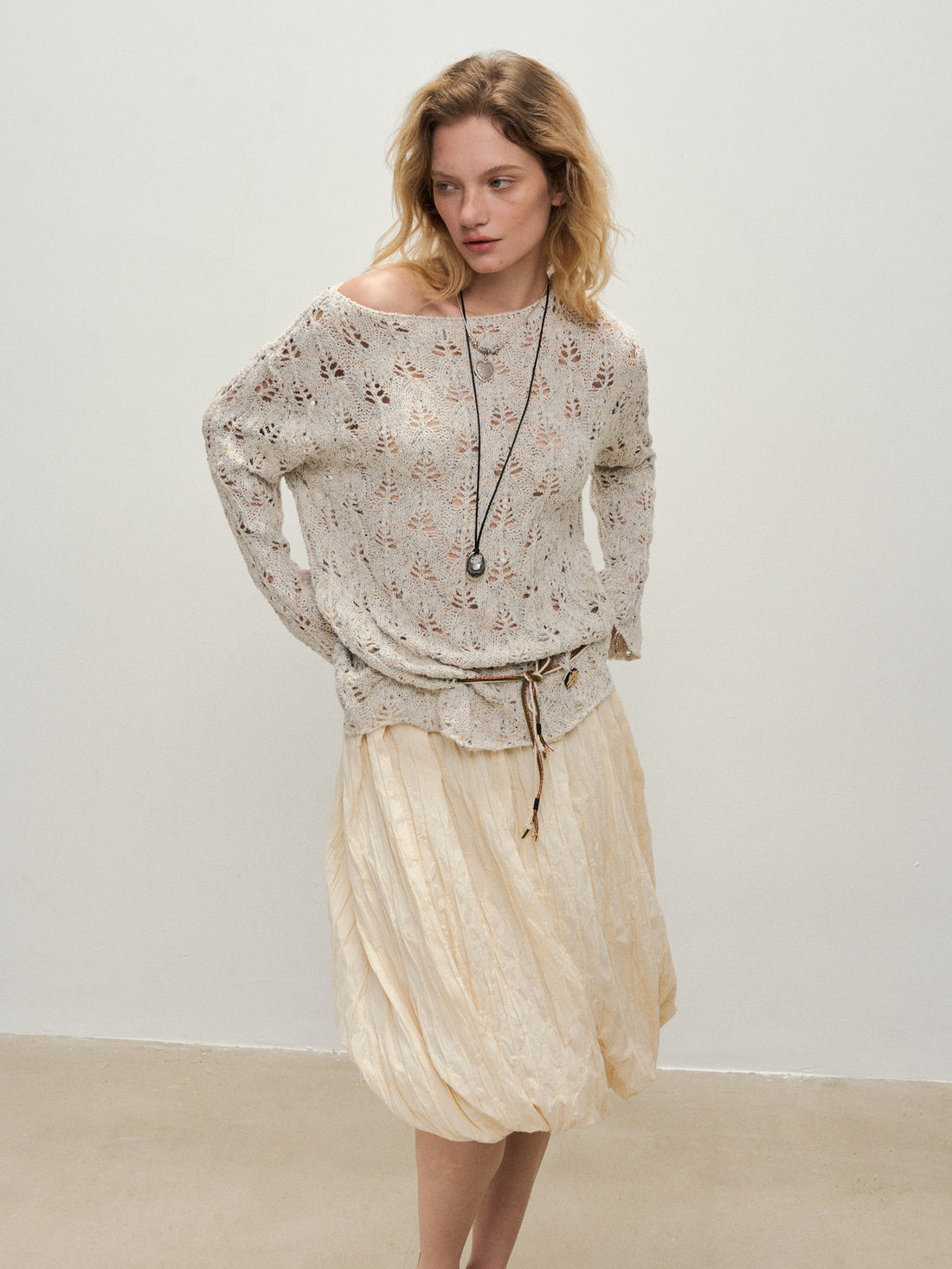 Dpercent 25SS A half-length skirt with slanted-cut and distorted texture structure