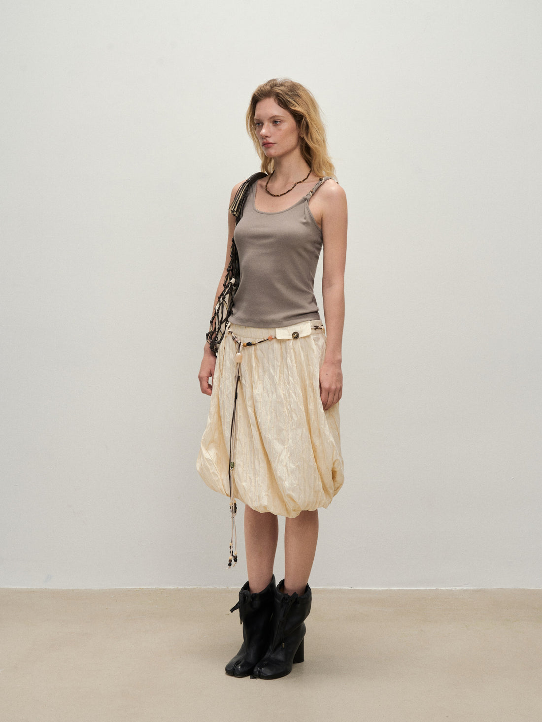 Dpercent 25SS A half-length skirt with slanted-cut and distorted texture structure