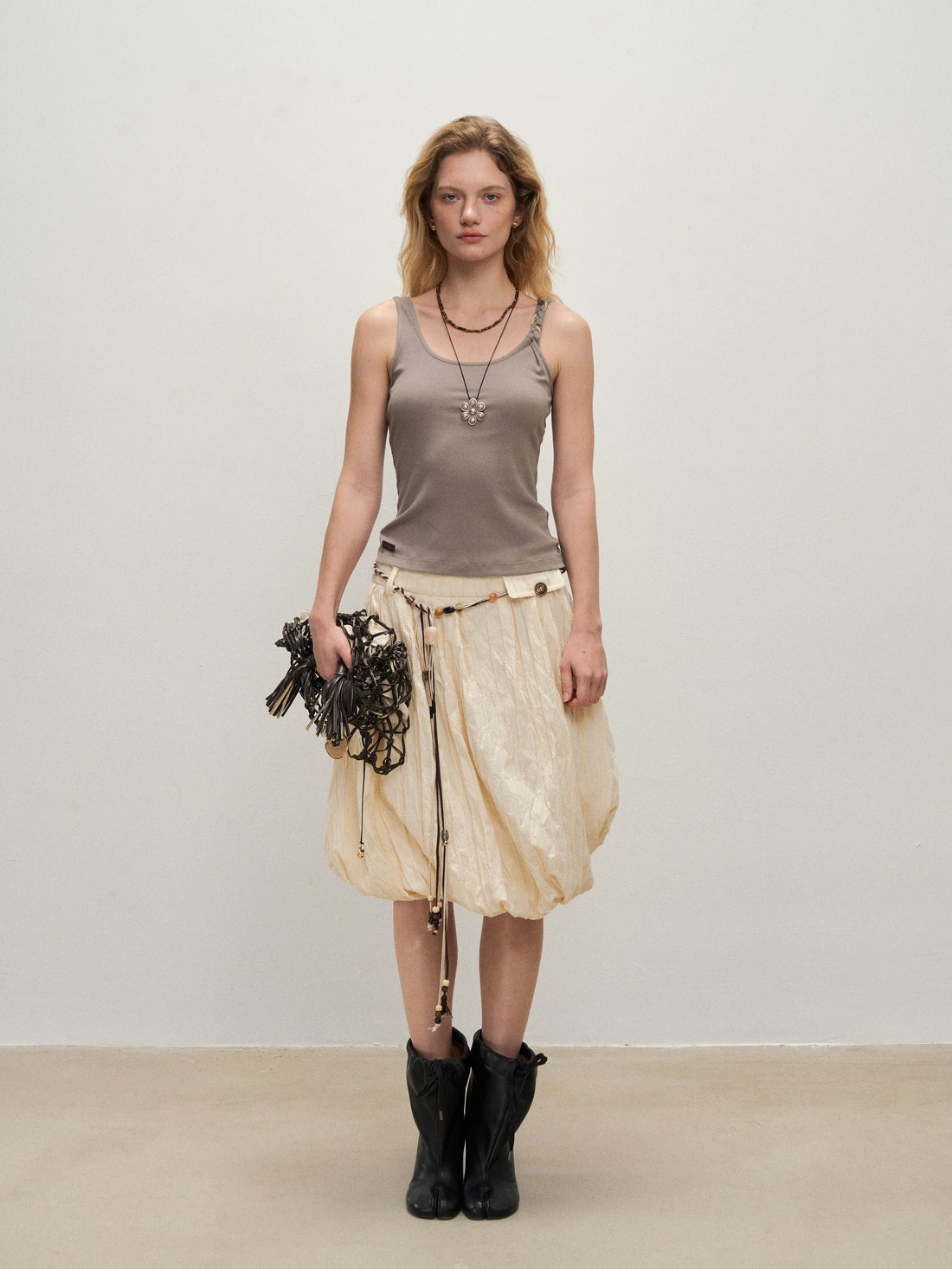 Dpercent 25SS A half-length skirt with slanted-cut and distorted texture structure