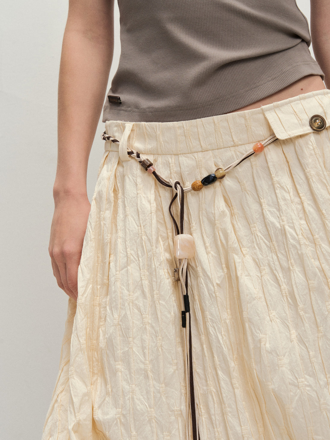 Dpercent 25SS A half-length skirt with slanted-cut and distorted texture structure